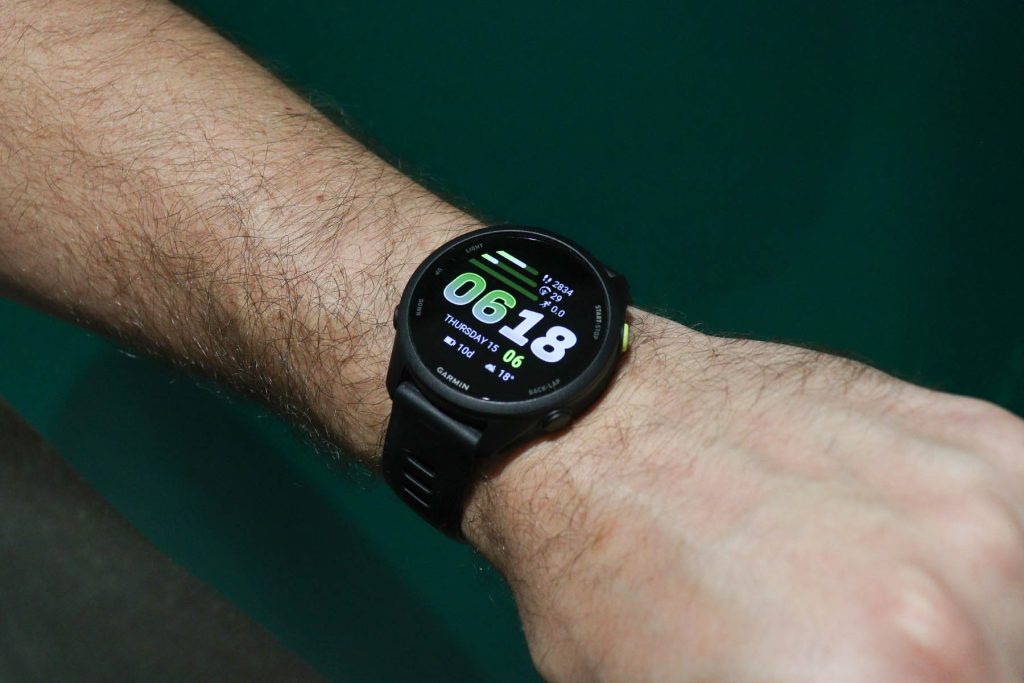 Garmin Forerunner 70 and its default watch face shown whilst wearing